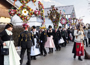AUSTRIA, GASTEIN - January 1, 2023: dancing characters in the perchtenlauf procession in the Austrian Gastein Valley. High quality photo