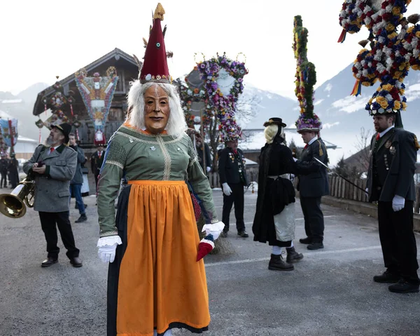 AUSTRIA, GASTEIN - January 1, 2023: The two-faced woman Perchta in the Perchtenlauf procession in the Austrian Valley. High quality photo