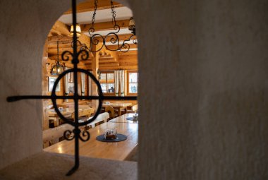Through window overlooking the restaurant hall in the Austrian mountain resort. High quality photo