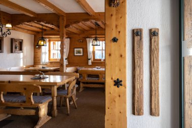 View from the entrance to the restaurant hall of the Austrian mountain hut. High quality photo