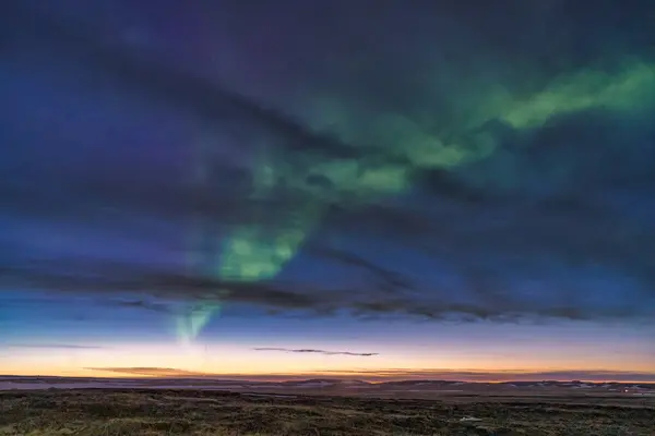 stock image Sunset and Aurora,a rare sight.  Also visible is the Hellissandur longwave radio mast (Icelandic: Langbylgjustin  Gufusklum)  which is 412 m tall Snaefellsnes peninsula, Iceland