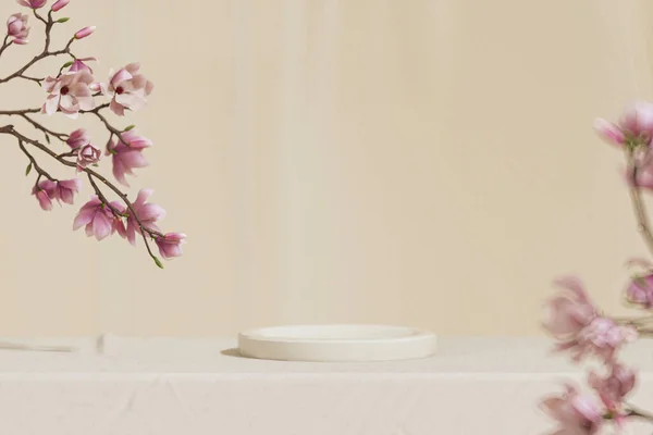 3D background, beige podium display. Sakura pink flower tree branch. Cosmetic or beauty product promotion step floral pedestal. Abstract minimal advertise. 3D render copy space spring mockup.