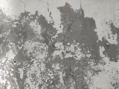 Grunge Duvar Dokusunu Soymak. Yamalanmış ve Yıpranmış Duvarlar. Paslı ve harap olmuş Duvar Yüzeyi. Çatlamış ve desenli Çimento Duvarı..