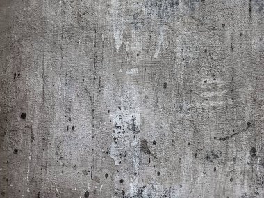 Boya parçaları kayıp. Çimento soyulmuş, yıpranmış grunge duvar dokusu. Gıcırdayan duvar. Grunge duvarı somutlaştırılmış. Eski, beyaz beton duvar..