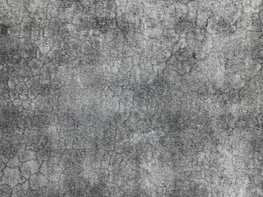 Kirli çatlamış beyaz duvar boyası dökülüyor. Kötü hasar görmüş eski duvar boyası soyuluyor. Boya parçaları kayıp. Çimento soyulmuş grunge duvar dokusundan sıyrılmış..