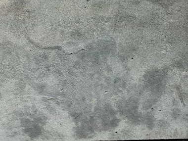 Kirli çatlamış beyaz duvar boyası dökülüyor. Kötü hasar görmüş eski duvar boyası soyuluyor. Boya parçaları kayıp. Çimento soyulmuş grunge duvar dokusundan sıyrılmış..