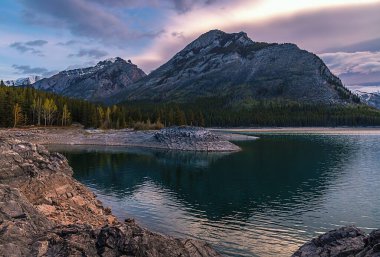 Cloudy Sunrise At Lake Minnewanka clipart