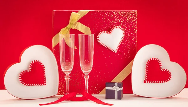 Valentine\'s Day wallpaper with a gift and glasses. Romantic composition for Valentine\'s Day, declaration of love, Mother\'s Day, birthday, wedding.