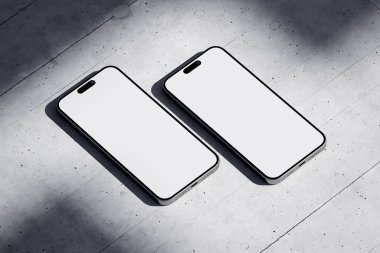 Two phones with a blank screen on a concrete background clipart