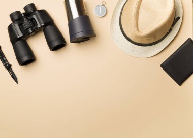 Travel accessories for mountain trip on color background, top view.