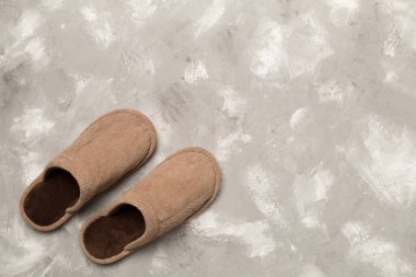 Man's slippers on wooden background, top view