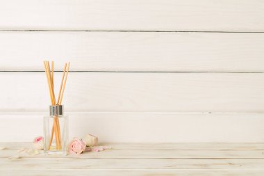 Air refresher bottle on light background.