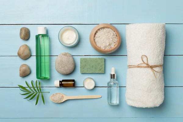 Composition with spa products on wooden background, top view.