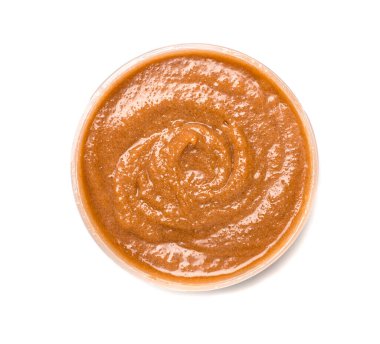 Natural chocolate scrub isolated on white, top view.