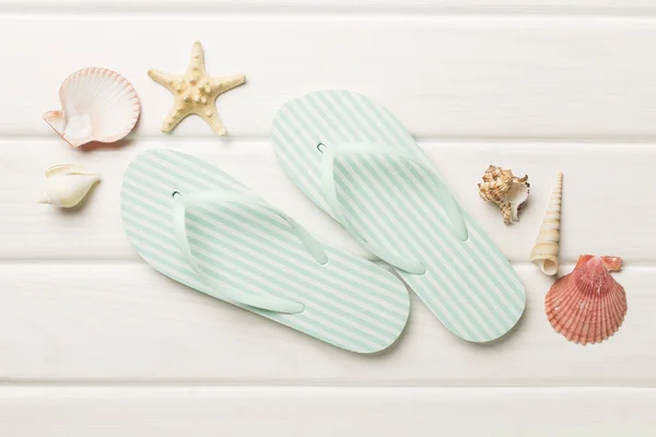 stock image Striped flip flops on wooden background, top view