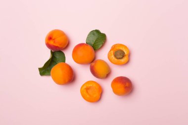 Flat lay with ripe ap.ricots on color background, top view.