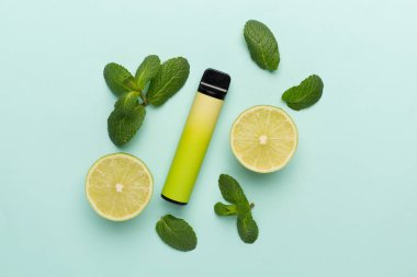 Disposable electronic cigarettes with fruits on color background, top view