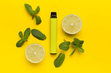 Disposable electronic cigarettes with fruits on color background, top view
