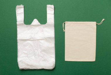 Plastic and fabric bag on color background, top view. Biodegradable products concept