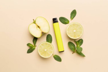 Disposable electronic cigarettes with fruits on color background, top view