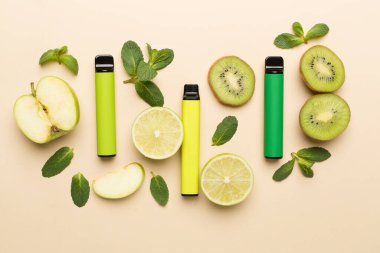 Disposable electronic cigarettes with fruits on color background, top view