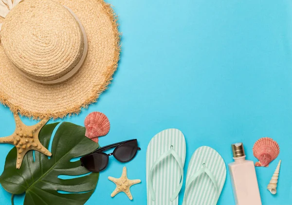 stock image Beach accessories on color background, flat lay