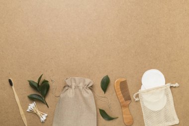 Flat lay with natural biodegradable accessories on wooden background, top view