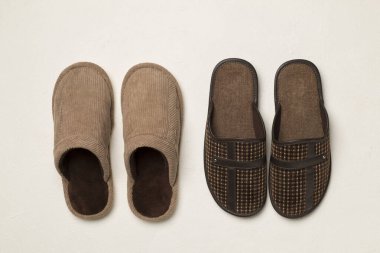 Man's slippers on wooden background, top view