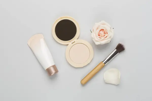 Composition with makeup products for skin tone on color background, top view
