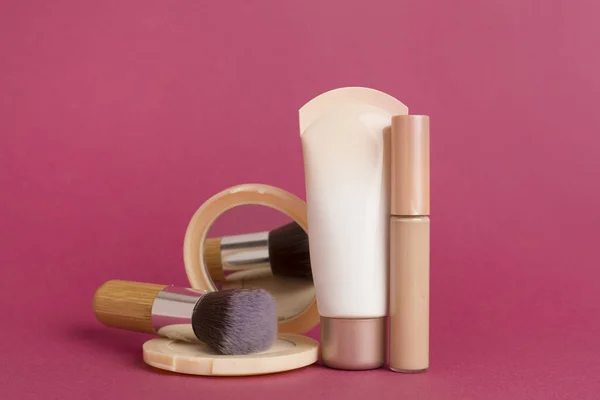 Composition with makeup products for skin tone on color background