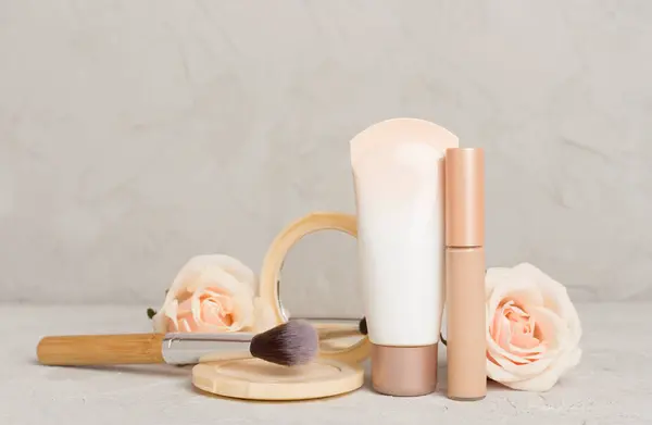 Composition with makeup products for skin tone on table