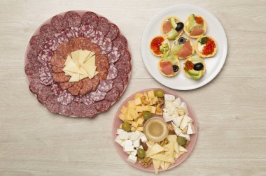 Different tasty snacks for party on wooden background, top view