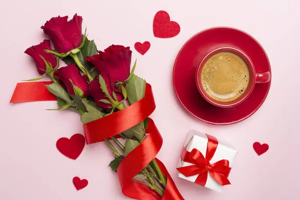 Gifts and coffee for valentines day on color background, top view