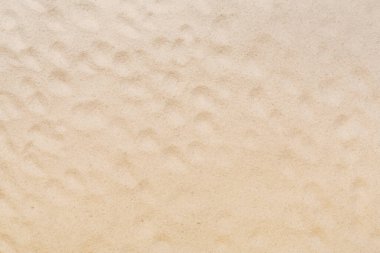 Arka plan olarak desenli kumsal kumu, üst manzara