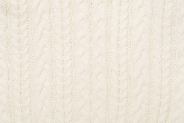 Arka plan olarak beyaz örülmüş kumaş dokusu, üst görünüm