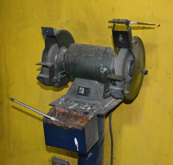 Bench grinder used for sharpening of knives, scissors and tools