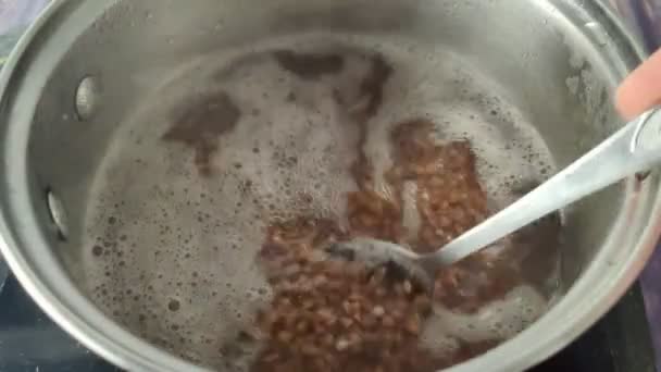 Stirring Buckwheat Spoon Boiling Water Saucepan Close — Stock video