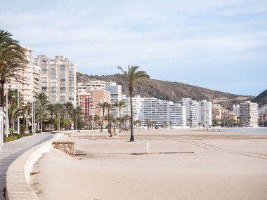 Cullera, Spain; March 4th 2024: Sant Antoni beach and promenade in Cullera, vacations town in Valencia clipart