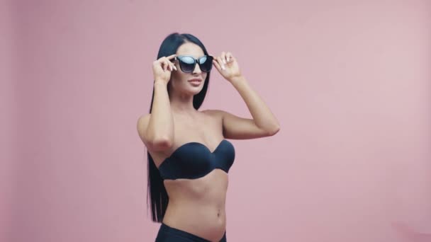 Beautiful Woman Swimsuit Sunglasses Standing Pink Background Positive Emotions Summer — Video Stock