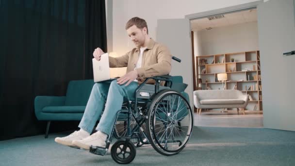Cheerful Disabled Caucasian Man Wheelchair Using Laptop Living Room Home — Stock Video