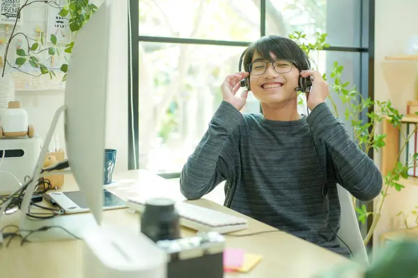 Happy Relaxed Teenager Man Asian Student Boy Rest Use Headphone Stock Photo