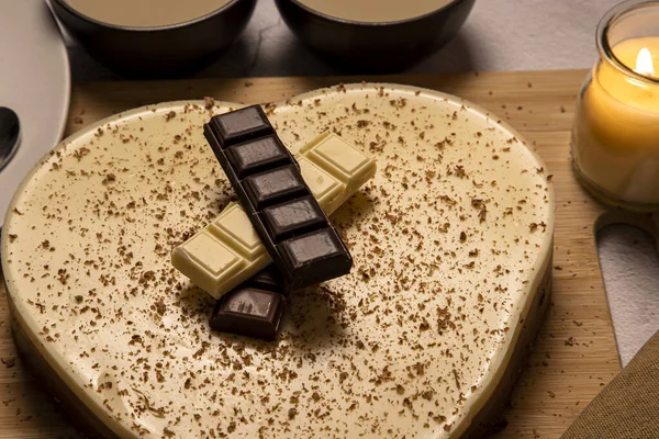 Three chocolates on a heart-shaped cake, especially Valentine\'s