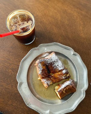 coffee and croissant on a wooden background
