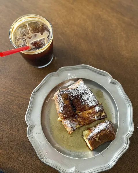 coffee and croissant on a wooden background