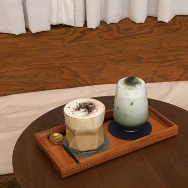coffee latte in a glass on a wooden table