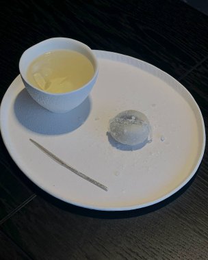 a closeup shot of a white bowl with a black background