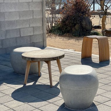 wooden chairs and tables in the garden
