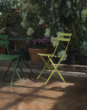 green chairs in the garden