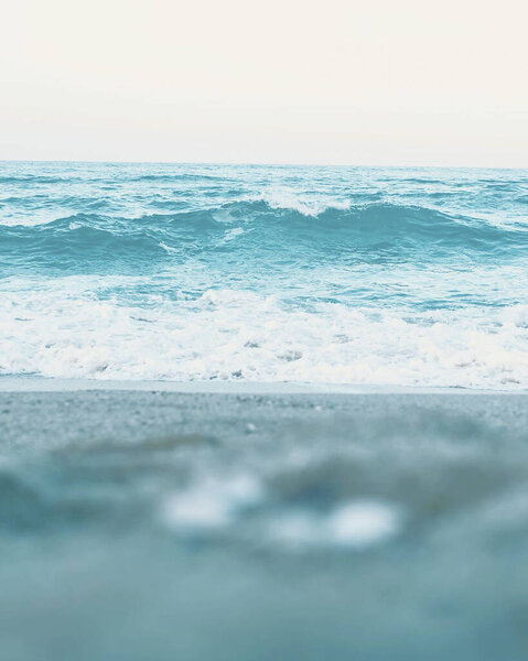 blue ocean waves with foam