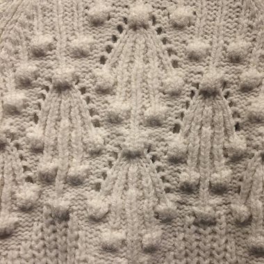 doku arkaplanı. Kumaş. Gri yün. beyaz örgü arkaplan.